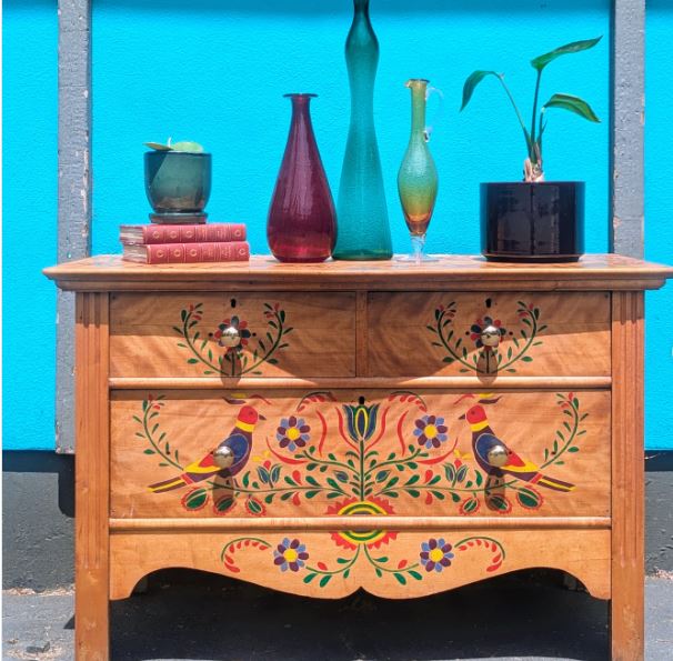 Paint Birds and Flowering Vines Across a Natural-Wood Dresser Paint Birds and Flowering Vines Across a Natural-Wood Dresser